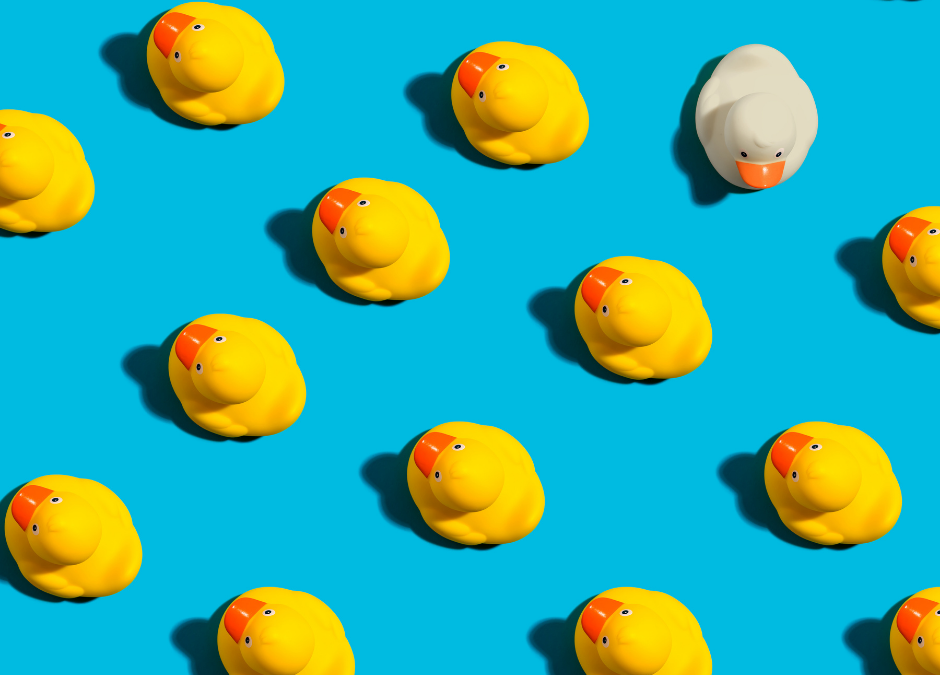 UCaaS Providers-Differentiate Yourself From The Big Brands-yellow ducks on blue background with one white duck facing the another direction
