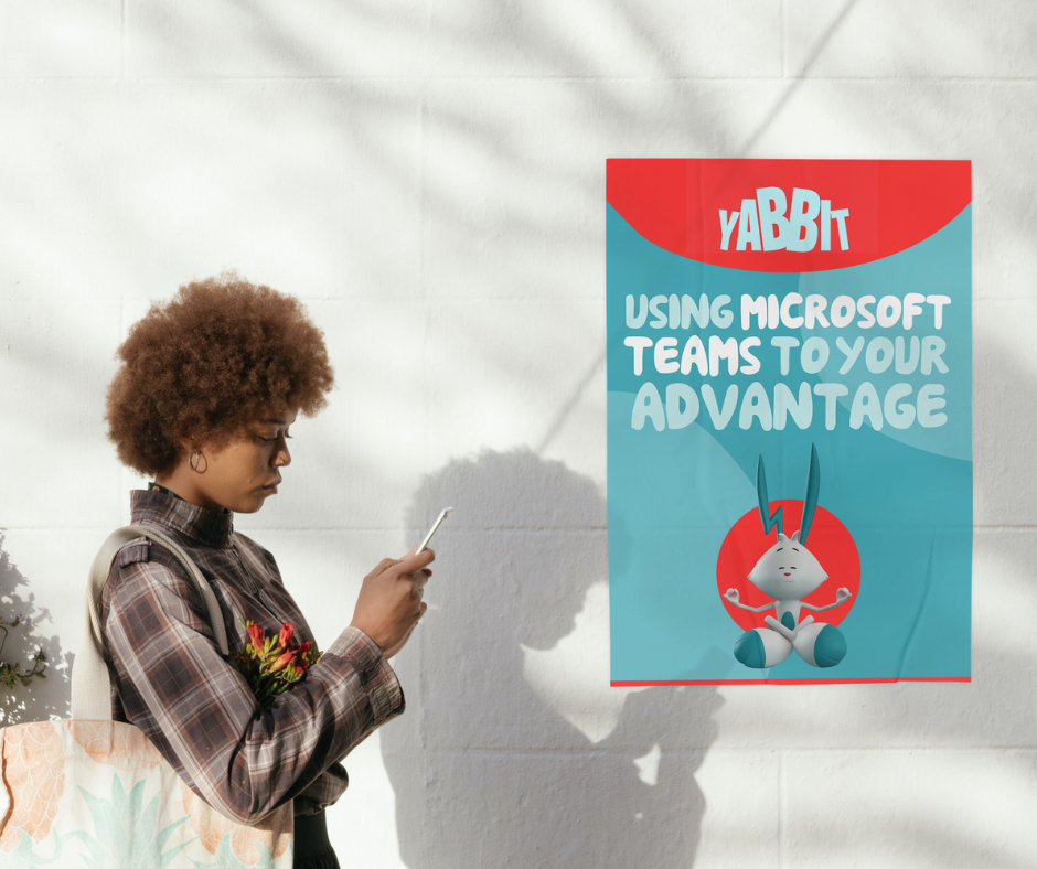 woman looking at cellphone with poster of eBook next to her - using ms teams to your advantage